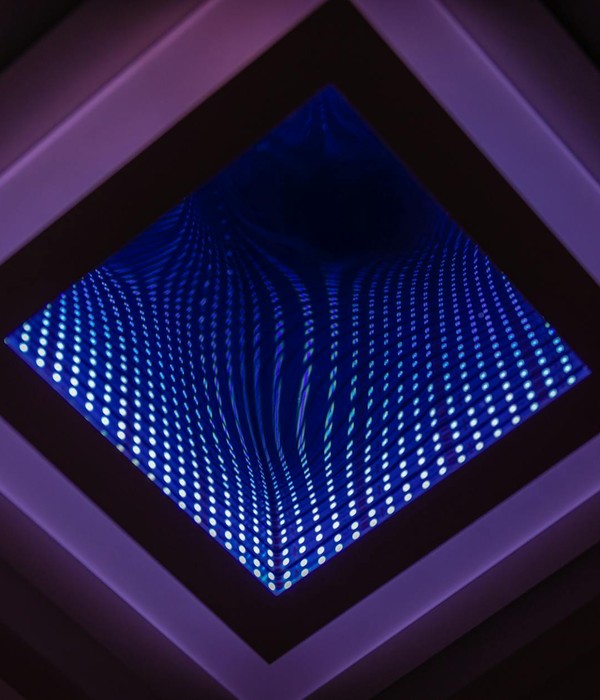 A captivating abstract view of a LED infinity mirror with vibrant light patterns.